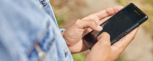 Users hands holding smartphone