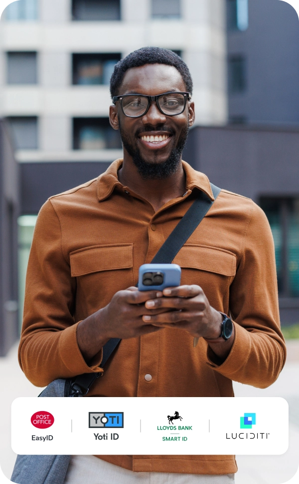 Man smiling holding phone overlayed with Digital ID app logos: Yoti ID, EasyID, Smart ID, Luciditi