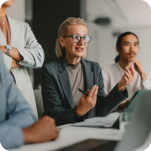 Woman talking to group in meeting