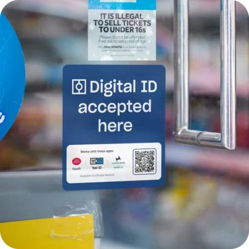 "Digital ID accepted here" window sticker on a shop front