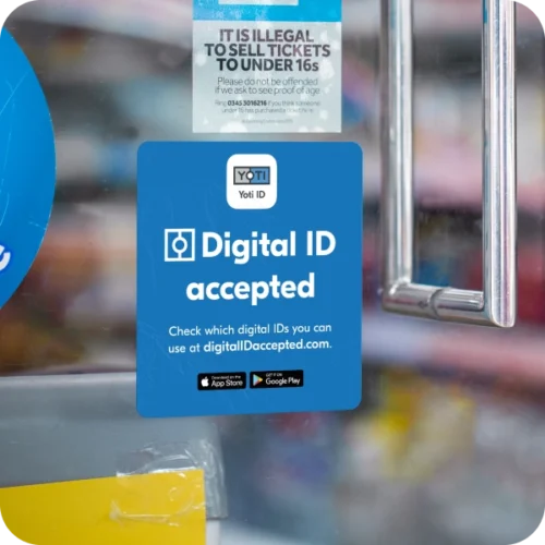 "Digital ID accepted here" window sticker on a shop front